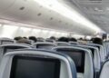 Woman gets violently sick on a 10-hour flight, and accidentally unlocks first class