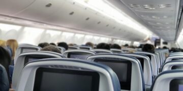 Woman gets violently sick on a 10-hour flight, and accidentally unlocks first class