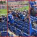 A video from a Duke football game shows many standing during a band performance. Then it highlights a group who stayed seated, The caption reads — stills from the TikTok posted by italian_cannoli_ravioli1